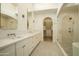 Bright bathroom features dual sinks, quartz counters, a shower, and a walk-in closet at 12776 N 78Th St, Scottsdale, AZ 85260