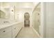 Bright bathroom features dual sinks, quartz counters, a shower, and a walk-in closet at 12776 N 78Th St, Scottsdale, AZ 85260