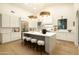 Bright, open kitchen featuring a large island, modern lighting, and stainless steel appliances at 12776 N 78Th St, Scottsdale, AZ 85260