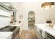 Gourmet kitchen featuring updated appliances, a farmhouse sink, and marble countertops at 12776 N 78Th St, Scottsdale, AZ 85260