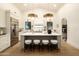 Bright, open kitchen featuring a large island, modern lighting, and stainless steel appliances at 12776 N 78Th St, Scottsdale, AZ 85260