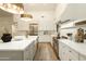 Well-lit kitchen with an island, marble countertops, state-of-the-art appliances, and a breakfast bar at 12776 N 78Th St, Scottsdale, AZ 85260
