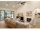 Spacious living room featuring a fireplace and sliding doors to the backyard at 12776 N 78Th St, Scottsdale, AZ 85260