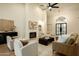 Elegant living room featuring a fireplace, comfortable seating, and an open floor plan at 12776 N 78Th St, Scottsdale, AZ 85260