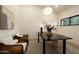 Bright home office with modern lighting, neutral color palette and comfortable seating at 12776 N 78Th St, Scottsdale, AZ 85260
