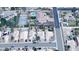 Aerial view of a home with a backyard pool, situated near a tennis court and green space at 1332 E Charleston Ave, Phoenix, AZ 85022