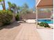 This backyard with pool and gravel landscaping, combined with a covered patio provides outdoor enjoyment and relaxation at 1332 E Charleston Ave, Phoenix, AZ 85022