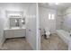 Bathroom featuring a double sink vanity and a tiled shower/tub combination at 1332 E Charleston Ave, Phoenix, AZ 85022