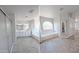 Bright bathroom with dual sinks, soaking tub, and tiled floors at 1332 E Charleston Ave, Phoenix, AZ 85022