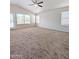 Bedroom with plush carpet, large windows, and natural light at 1332 E Charleston Ave, Phoenix, AZ 85022