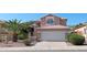 Well-maintained two-story home with desert landscaping, a tile roof, and a spacious two-car garage at 1332 E Charleston Ave, Phoenix, AZ 85022