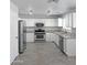 Modern kitchen with stainless steel appliances and granite countertops at 1332 E Charleston Ave, Phoenix, AZ 85022