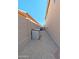 Functional side yard with gravel, storage unit and block fence offers practicality and privacy at 1332 E Charleston Ave, Phoenix, AZ 85022