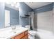 Updated bathroom with modern vanity, tiled shower, and convenient storage at 1402 E Guadalupe Rd # 207, Tempe, AZ 85283
