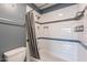 Updated bathroom features a shower over tub with subway tile surround and convenient storage shelves at 1402 E Guadalupe Rd # 207, Tempe, AZ 85283