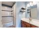 Updated bathroom showcasing a new shower and bathtub combo, stylish vanity, and modern finishes at 1402 E Guadalupe Rd # 207, Tempe, AZ 85283