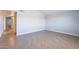 Spacious bedroom featuring a vaulted ceiling, light gray vinyl floors, and fresh neutral paint at 1402 E Guadalupe Rd # 207, Tempe, AZ 85283
