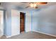 Bedroom with carpet flooring and an open closet with built-in storage at 1402 E Guadalupe Rd # 207, Tempe, AZ 85283