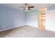 Bedroom boasting plush carpet, ceiling fan, and convenient ensuite bathroom access at 1402 E Guadalupe Rd # 207, Tempe, AZ 85283