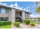 Charming condo featuring stone accents, a cozy entryway, and well-maintained landscaping at 1402 E Guadalupe Rd # 207, Tempe, AZ 85283