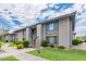 Inviting apartment complex with well-manicured lawns and walkways under a bright, cloudy sky at 1402 E Guadalupe Rd # 207, Tempe, AZ 85283