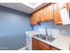 Well-lit kitchen with stainless steel sink, modern appliances, and white countertop at 1402 E Guadalupe Rd # 207, Tempe, AZ 85283