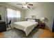 Simple yet stylish bedroom featuring hardwood floors, a cozy bed, and side tables with minimalist decor at 1412 W 7Th Pl, Tempe, AZ 85281