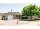 Well-maintained single-story home with brick accents, a garage, and a front lawn at 1412 W 7Th Pl, Tempe, AZ 85281