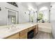 Well-lit bathroom with dual sinks, vanity space, and bathtub with plantation shutters at 1575 S Pennington Dr, Chandler, AZ 85286