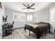 Comfortable bedroom featuring wood floors, desk, and a ceiling fan at 1575 S Pennington Dr, Chandler, AZ 85286