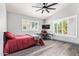 This bedroom is bright and has a ceiling fan and good light from windows at 1575 S Pennington Dr, Chandler, AZ 85286