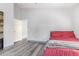Guest bedroom showcasing natural light and wood floors at 1575 S Pennington Dr, Chandler, AZ 85286