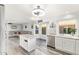 Bright kitchen overlooking living area, with an island, stainless steel appliances, and stylish finishes at 1575 S Pennington Dr, Chandler, AZ 85286