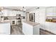 Updated kitchen with stainless steel appliances, a kitchen island, and gray-toned flooring at 1575 S Pennington Dr, Chandler, AZ 85286