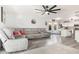 Spacious living room with a large sectional, ceiling fan, that flows into an open kitchen concept at 1575 S Pennington Dr, Chandler, AZ 85286