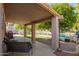 Covered patio for outdoor entertaining with lake view at 1575 S Pennington Dr, Chandler, AZ 85286