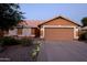 Charming single-story home with a well-maintained front yard and a two-car garage at 16011 N 35Th Dr, Phoenix, AZ 85053
