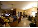 Cozy living room featuring tile floors, a ceiling fan, and a combined dining area at 16011 N 35Th Dr, Phoenix, AZ 85053