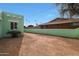 View of backyard and privacy wall, showcasing the back exterior of the house at 1613 W Flower N Cir, Phoenix, AZ 85015