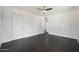 Bedroom with hardwood floors, a ceiling fan, and two separate closets at 1613 W Flower N Cir, Phoenix, AZ 85015