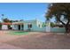 Inviting front exterior showing desert landscaping with a touch of artifical grass at 1613 W Flower N Cir, Phoenix, AZ 85015