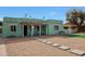 Charming home featuring a front porch with seating and desert landscaping at 1613 W Flower N Cir, Phoenix, AZ 85015