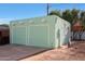 Detached two-car garage with a charming vintage style at 1613 W Flower N Cir, Phoenix, AZ 85015