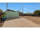 A detached garage with two garage door bays is set back from the house at 1613 W Flower N Cir, Phoenix, AZ 85015