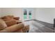 Comfortable sitting area featuring a leather sofa and access to the outdoors at 1613 W Flower N Cir, Phoenix, AZ 85015