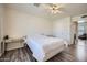 Bedroom featuring wood-look floors, ceiling fan and a mirrored vanity at 17232 N 29Th Ave, Phoenix, AZ 85053