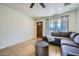 Inviting living room with tile flooring, ceiling fan and ample natural light at 17232 N 29Th Ave, Phoenix, AZ 85053