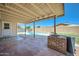 Covered patio area with a brick grill and view of the refreshing backyard pool at 17232 N 29Th Ave, Phoenix, AZ 85053