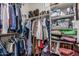 Organized walk-in closet with shelving, hanging rods, and ample storage space for clothing and shoes at 1849 S Balboa Dr, Gilbert, AZ 85295