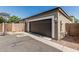 View of home's exterior featuring a large garage and basketball hoop at 1849 S Balboa Dr, Gilbert, AZ 85295